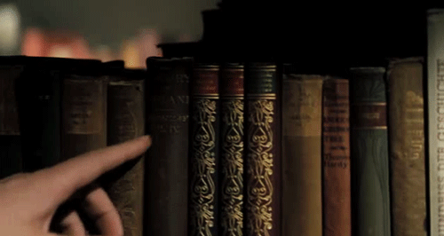 http://bestanimations.com/Books/finger-passes-along-book-spines-library-animated-gif.gif