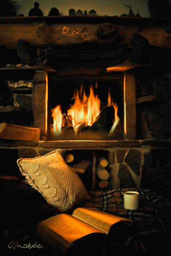 animated book by the fireplace gif