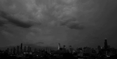 thunder lightning strikes storm over city animated gif